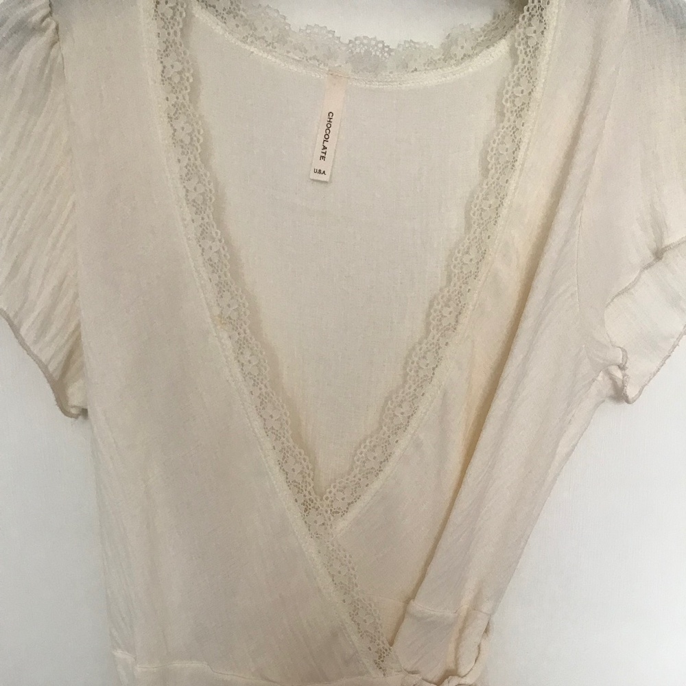 White, medium in size, cross over top
